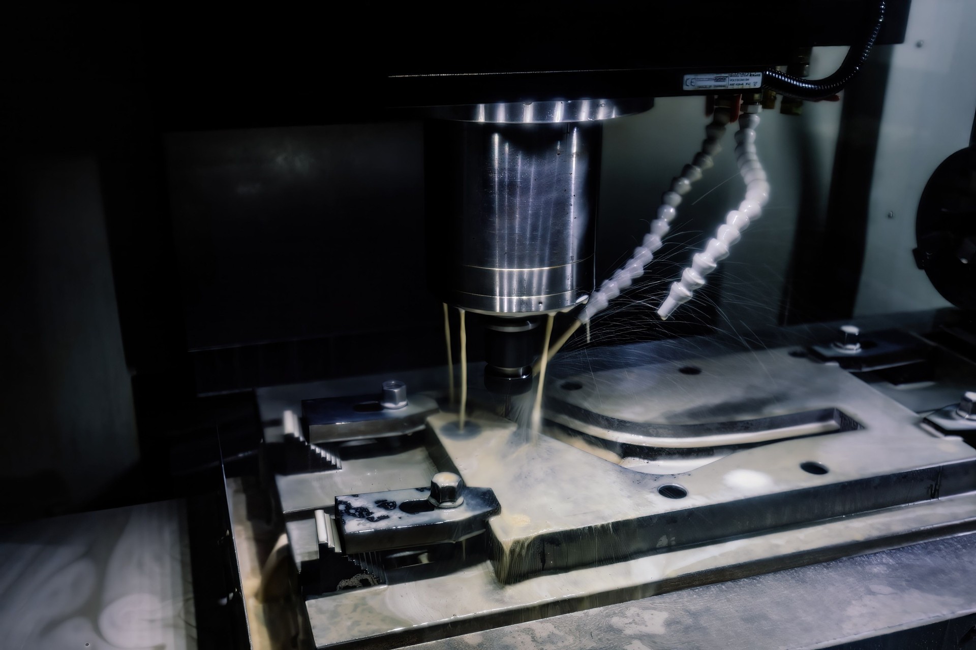 Working CNC milling machine with liquid coolant