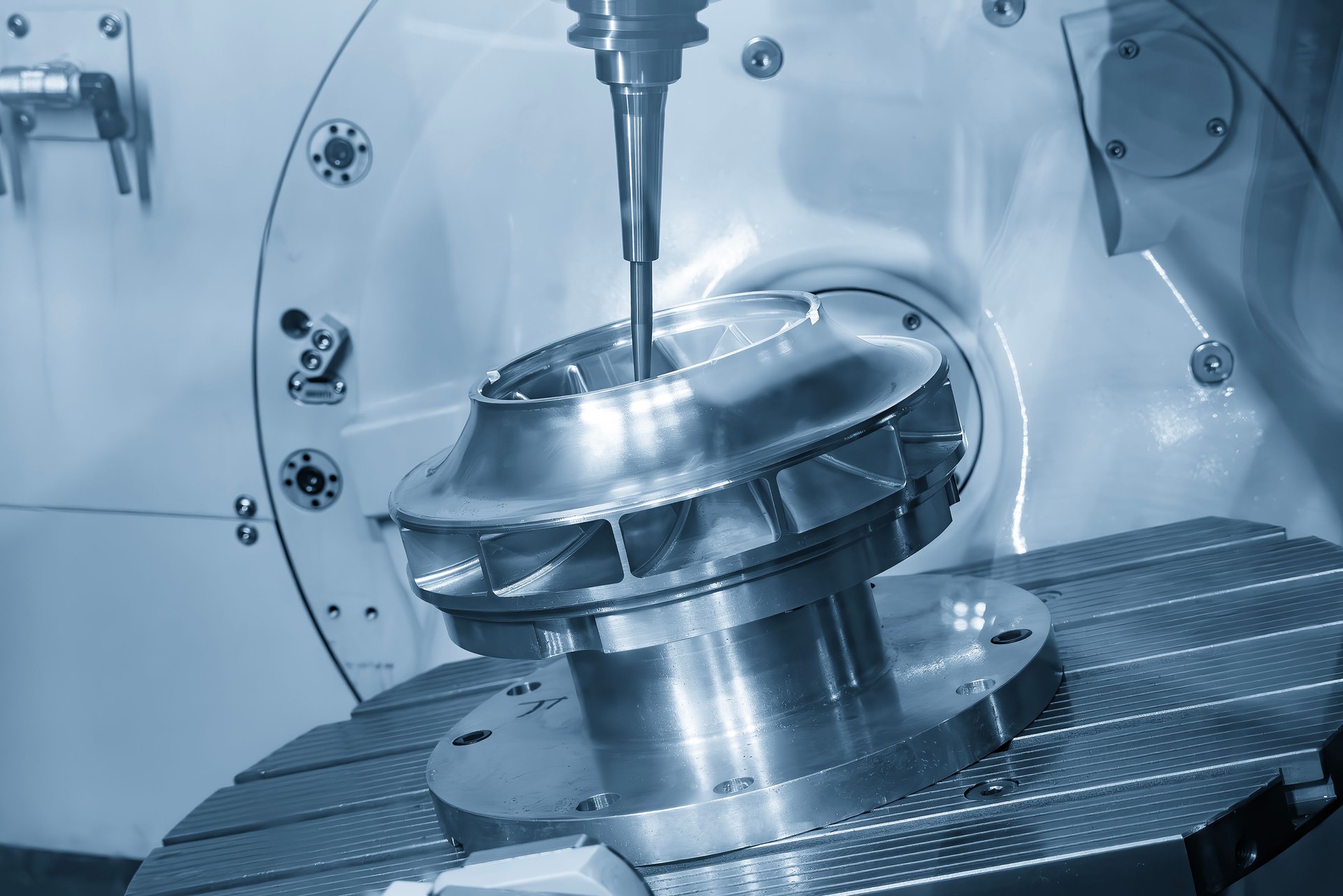 The 5-axis CNC milling machine cutting the high precision turbine part with solid ball end mill tool.